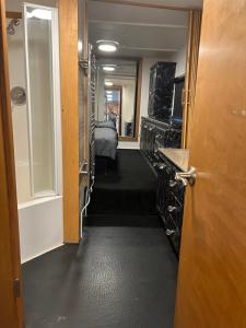 a hallway with a room with a bed and a door at Winnie baygo Meadow view in Hurst