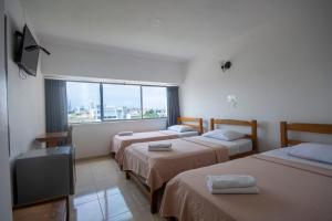 Postel nebo postele na pokoji v ubytování Hotel Stil Cartagena