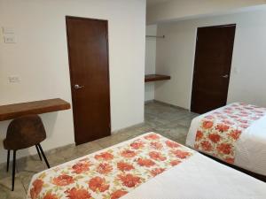 Postel nebo postele na pokoji v ubytování Hotel Lorimar