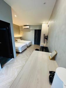 Postel nebo postele na pokoji v ubytování Tai Dong Jin Kuai Homestay