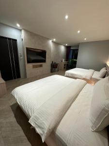 Postel nebo postele na pokoji v ubytování Tai Dong Jin Kuai Homestay