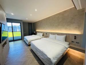Postel nebo postele na pokoji v ubytování Tai Dong Jin Kuai Homestay
