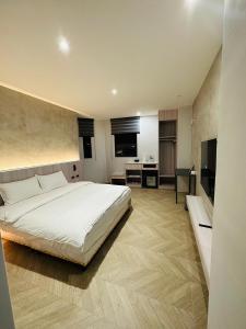 Postel nebo postele na pokoji v ubytování Tai Dong Jin Kuai Homestay