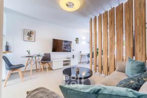 a living room with a couch and a table at Apartment Paraiso Royal in Arona
