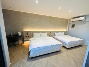 Postel nebo postele na pokoji v ubytování Tai Dong Jin Kuai Homestay