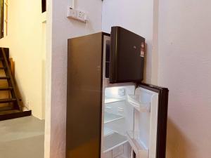 Kuchyň nebo kuchyňský kout v ubytování Inap Desa R'Sawit Pintu A