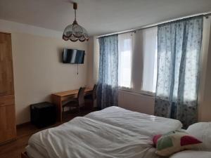 Postel nebo postele na pokoji v ubytování Gasthof Weidenauer- Gabi's Café