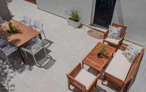 an overhead view of a patio with tables and chairs at New seafront apartments in Skrivena Luka in Skrivena Luka +35 photos