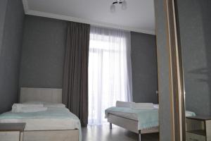 Llit o llits en una habitació de Hotel Elegant