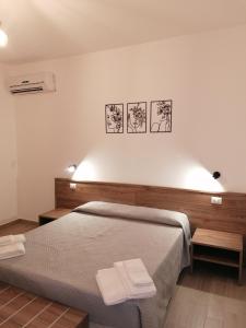 Postel nebo postele na pokoji v ubytování CLASS ROOMS AFFITTACAMERE