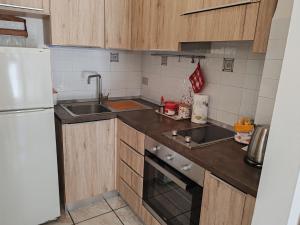 Kuchyň nebo kuchyňský kout v ubytování SiroloHome + 7 fotografií