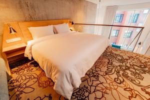 Katil atau katil-katil dalam bilik di GO Quito Hotel