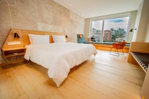 Katil atau katil-katil dalam bilik di GO Quito Hotel