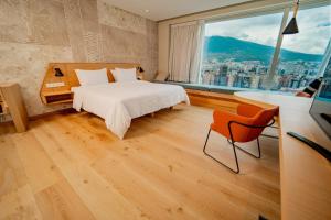 Katil atau katil-katil dalam bilik di GO Quito Hotel