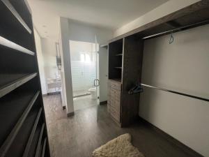 a bathroom with a shower and a toilet and a sink at Casa Concept Delicias in Delicias