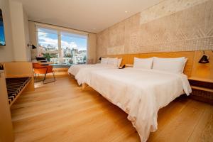 Katil atau katil-katil dalam bilik di GO Quito Hotel