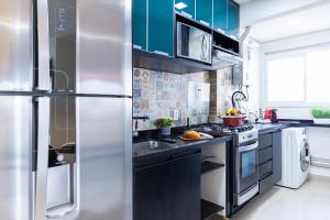 Η κουζίνα ή μικρή κουζίνα στο Apt no Butantã com AC, 3 Quartos, Vaga, Piscina