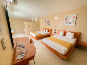 Postel nebo postele na pokoji v ubytování Auto Hotel Mediterráneo