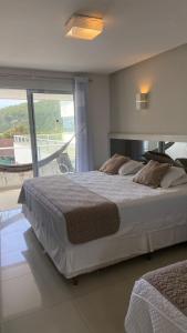 Postel nebo postele na pokoji v ubytování Reserva Praia Hotel