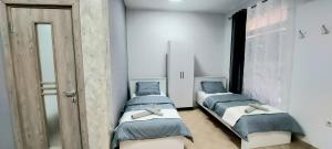 Postel nebo postele na pokoji v ubytování Apartman SPLENDID