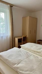 Posteľ alebo postele v izbe v ubytovaní Apartment Römerhaus