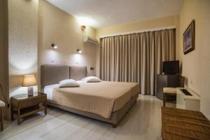 Krevet ili kreveti u jedinici u okviru objekta Olympic Hotel
