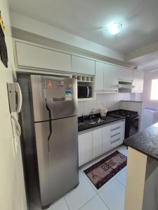 Køkken eller tekøkken på Apartamento E-23 Edifício Villa Monreale - Praia Itaguá + 6 billeder