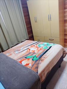 En eller flere senge i et værelse på Casa Vó Rose