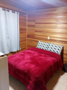 En eller flere senge i et værelse på Casa Vó Rose + 5 billeder