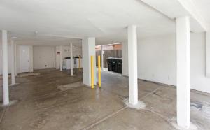 an empty room with white pillars in a building at 1404 W Oceanfront B in Newport Beach