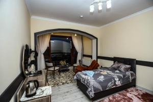 Postel nebo postele na pokoji v ubytování VƏTƏN Hotel