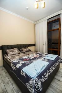 Postel nebo postele na pokoji v ubytování VƏTƏN Hotel