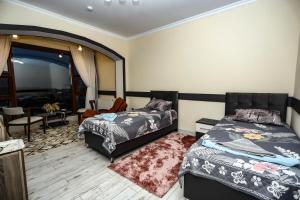 Postel nebo postele na pokoji v ubytování VƏTƏN Hotel