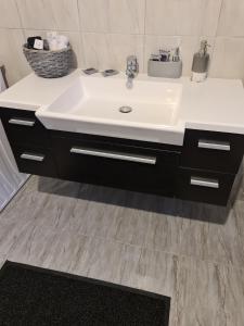 a bathroom with a white sink and a counter at Relax an' Chill in Thessaloniki +43 photos