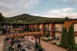 a view of a hotel with a mountain in the background at The Beaucatcher, a Boutique Motel in Asheville