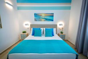Posteľ alebo postele v izbe v ubytovaní Golden Holiday 2 Ville con piscine indipendenti e separate