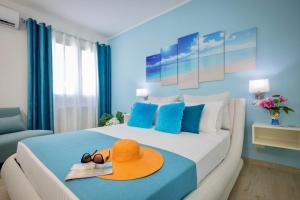 Posteľ alebo postele v izbe v ubytovaní Golden Holiday 2 Ville con piscine indipendenti e separate