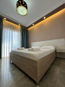 Postel nebo postele na pokoji v ubytování Hotel Qetesia-Te Indriti