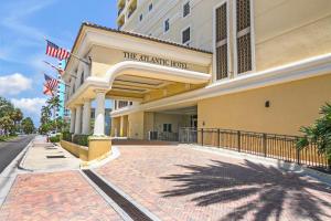 a building with a sign for the naperville hotel at The Atlantic Hotel & Spa in Fort Lauderdale