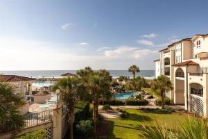 a view of a resort with a pool and the ocean at Oceanfront Resort! at Ocean Delight! in North Topsail Beach
