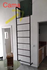 a ladder against a wall in a room at Monte da Lua in Montargil