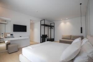 Postel nebo postele na pokoji v ubytování Arrei Hotel