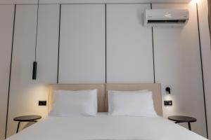 Postel nebo postele na pokoji v ubytování Arrei Hotel
