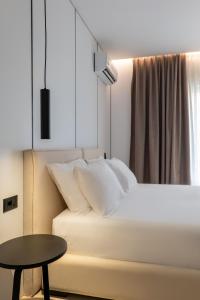 Postel nebo postele na pokoji v ubytování Arrei Hotel