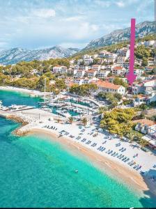 an aerial view of a beach with a pink arrow at Brela S1 S4-no parking in Brela