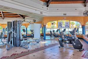 a gym with treadmills and cardio equipment in a building at Sandy Beach Princesa D107 Ocean Front Resort in Puerto Peñasco
