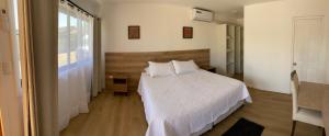 Postel nebo postele na pokoji v ubytování Casa Parral Hostal + 8 fotografií