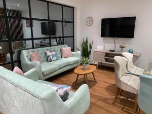 Телевизор и/или развлекательный центр в Turista en casa Apartamento con 100 m2