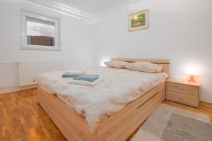 Postel nebo postele na pokoji v ubytování Čarobni pogled Zagreb