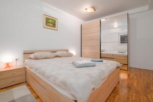 Postel nebo postele na pokoji v ubytování Čarobni pogled Zagreb + 37 fotografií